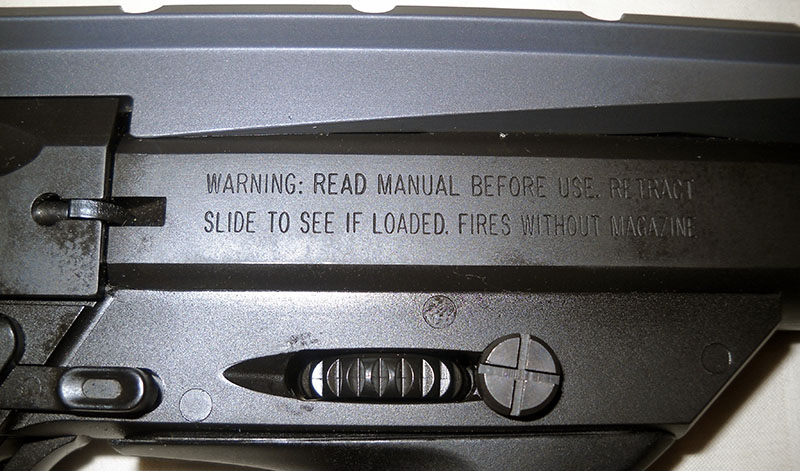 Beretta U22 Neos markings, right side: WARNING: READ MANUAL BEFORE USE. RETRACT SLIDE TO SEE IF LOADED. FIRES WITHOUT MAGAZINE